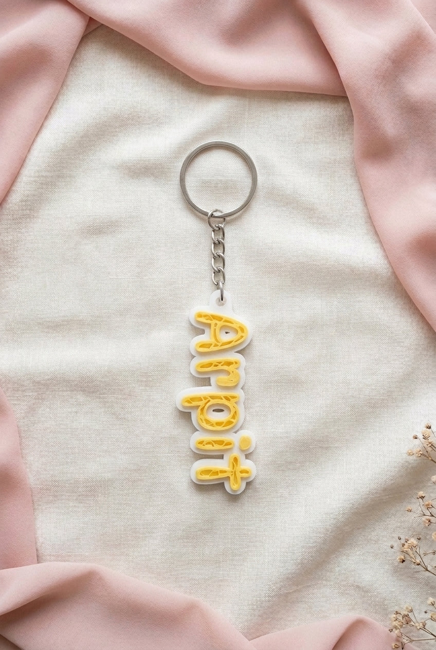 Vertical front view of Yellow NameLoop personalized name keychain with included keyring